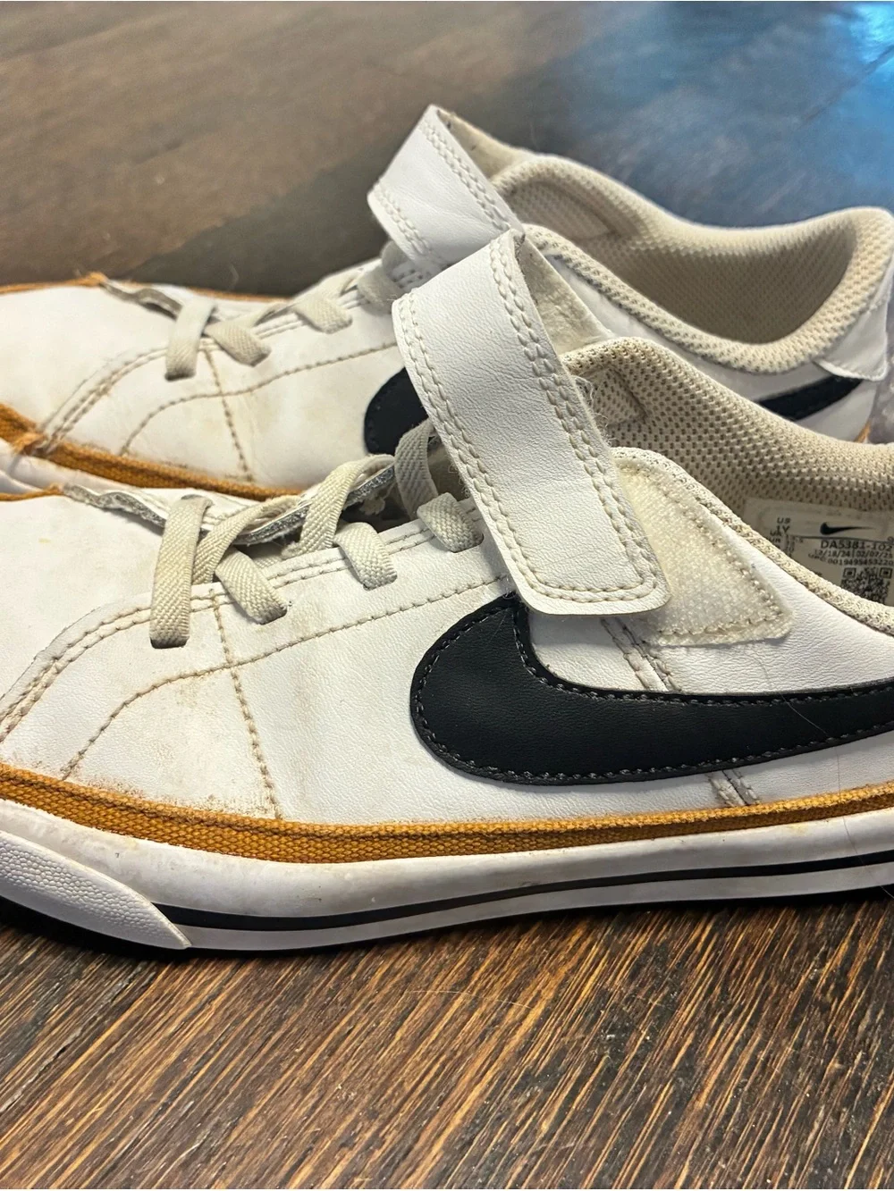 Nike Kids White Sneakers with Black Swoosh and Tan Trim